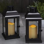 Solar Powered Outdoor Lanterns 11 Inch Tall Set of 2 Decorative Candle Lantern for Patio Waterproof Black Metal & Glass LED Pillar Candle Dusk to Dawn Timer Batteries Included